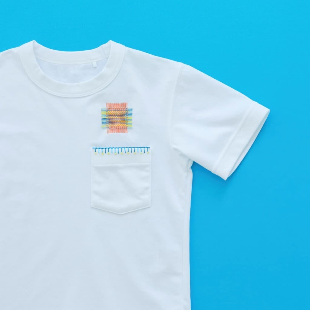 Decorative sashiko mending on a T-shirt