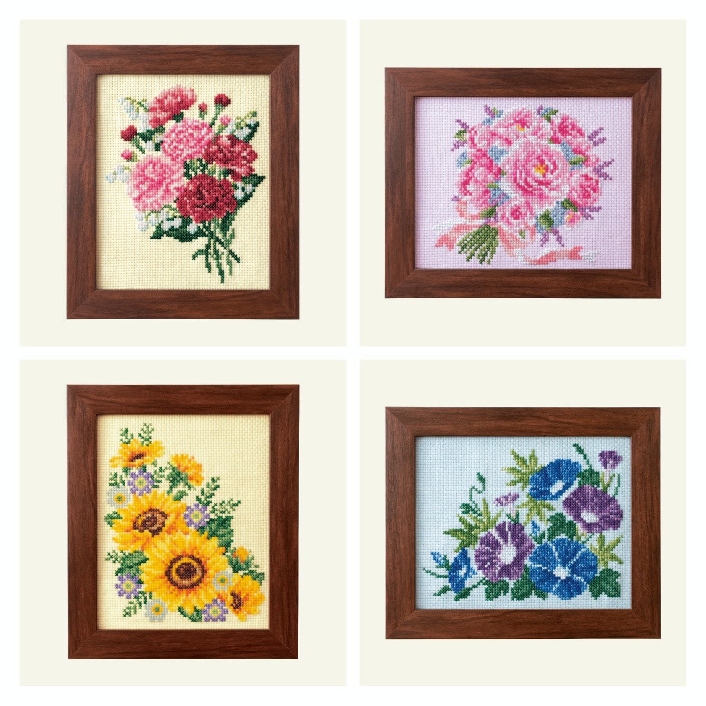 Four framed floral bouquet embroideries including carnations, roses, sunflowers, and morning glories