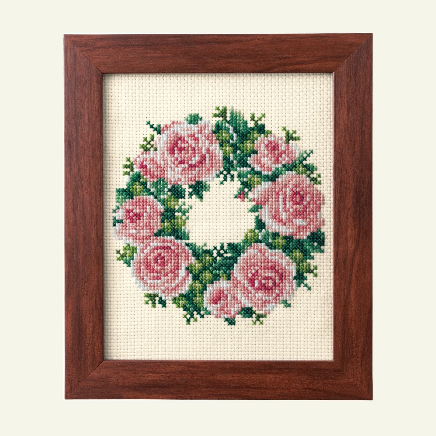 Detail of framed floral wreath embroidery