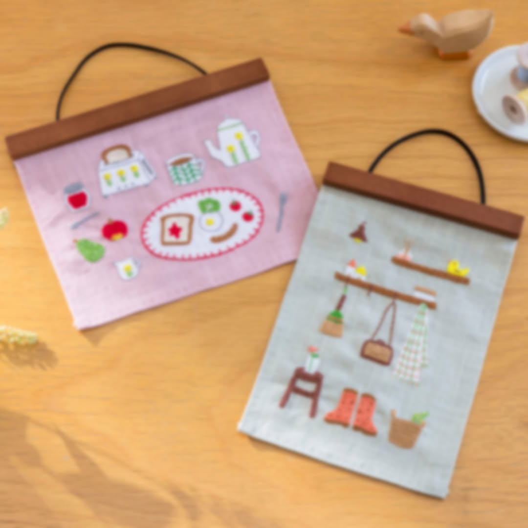 Breakfast and entryway hangings styled flat with spools and bird figurine