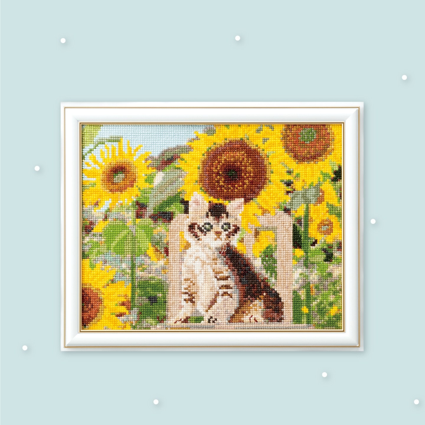 Framed pictorial cross-stitch of a kitten among sunflowers