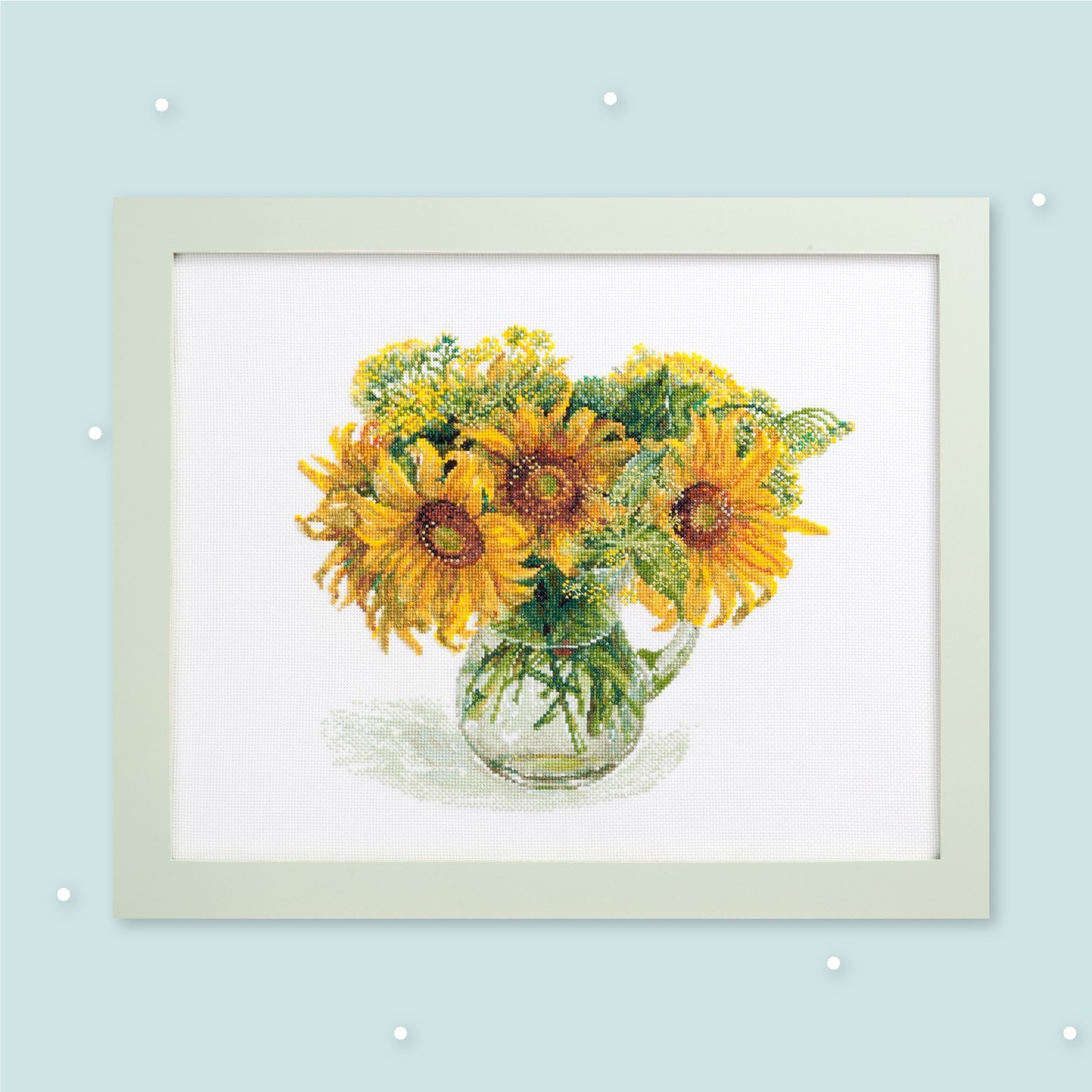 Framed pictorial cross-stitch of sunflowers in a glass pitcher