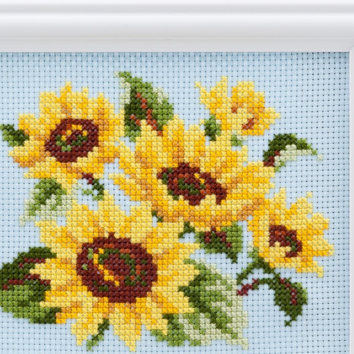 Zoomed detail of the same sunflower cross-stitch petals and centers