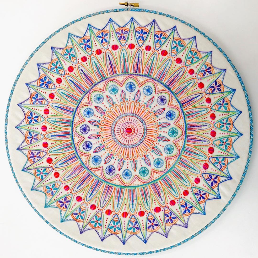 Multicolor geometric mandala embroidery in a hoop