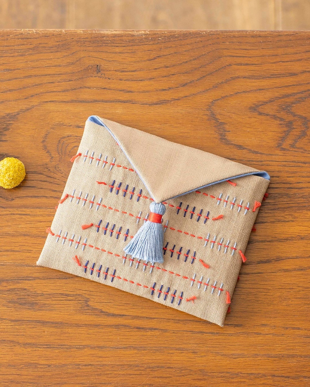 Close arrangement of sashiko pouches with geometric and wheat motifs