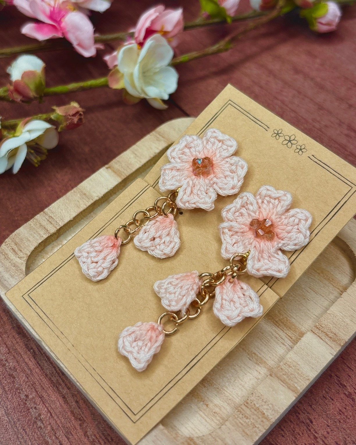 Crocheted sakura blossom earrings with green beads and gold findings