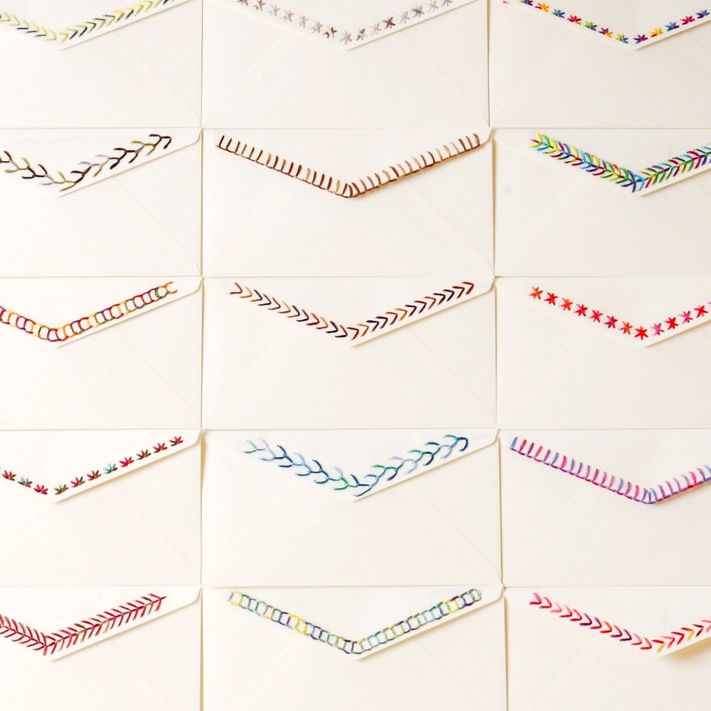 Embroidered envelope flaps stitched with COSMO Seasons variegated floss
