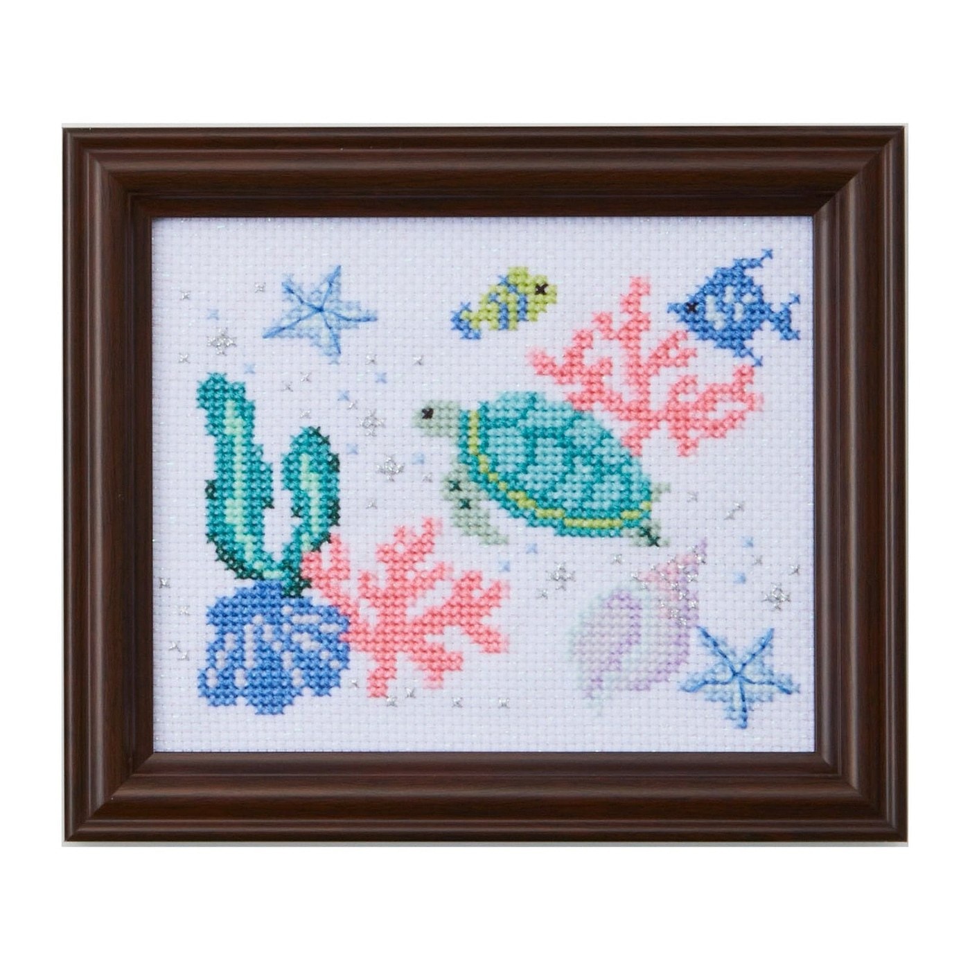 Framed cross-stitch of sea creatures—turtle, fish, and coral—worked in COSMO floss