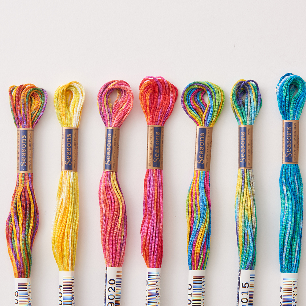 COSMO Seasons variegated embroidery floss skeins showing soft color shifts