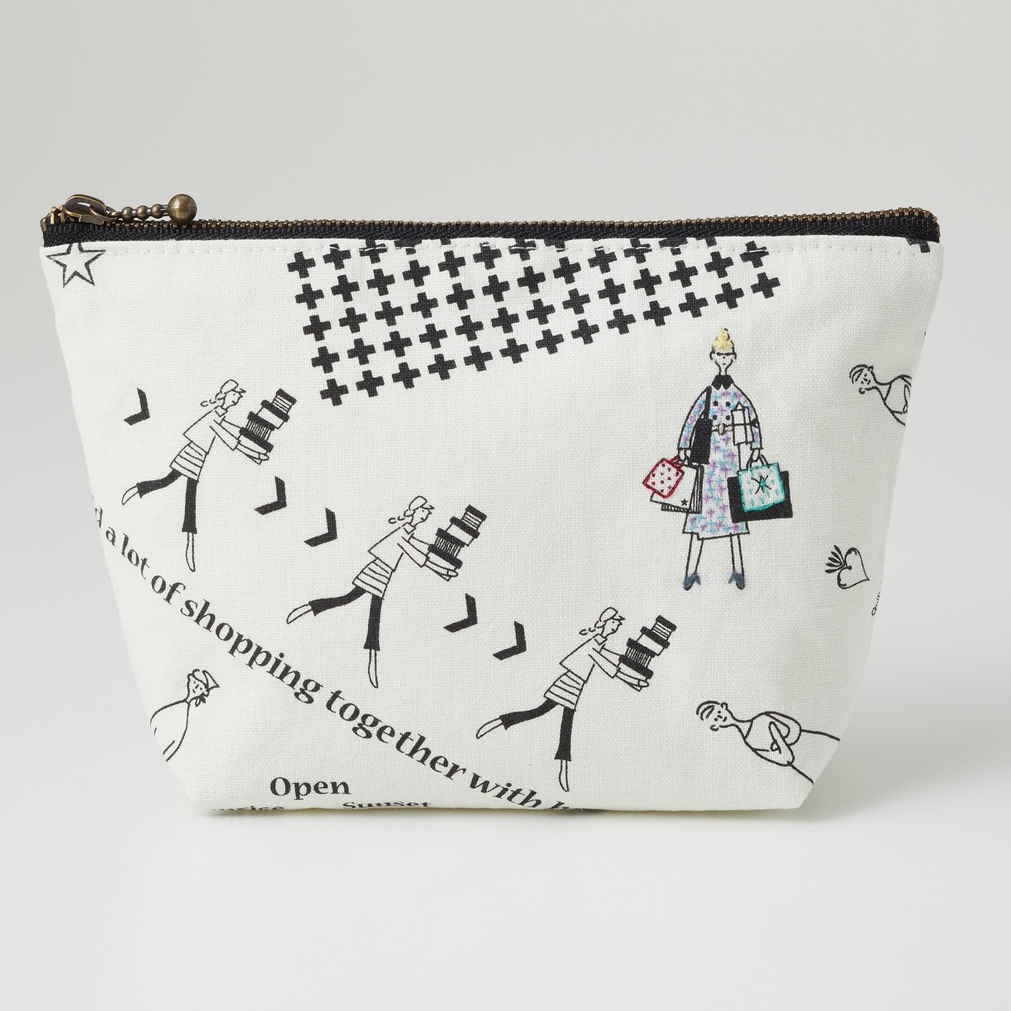 Close view of embroidered fashion-figure tote with accent stitching