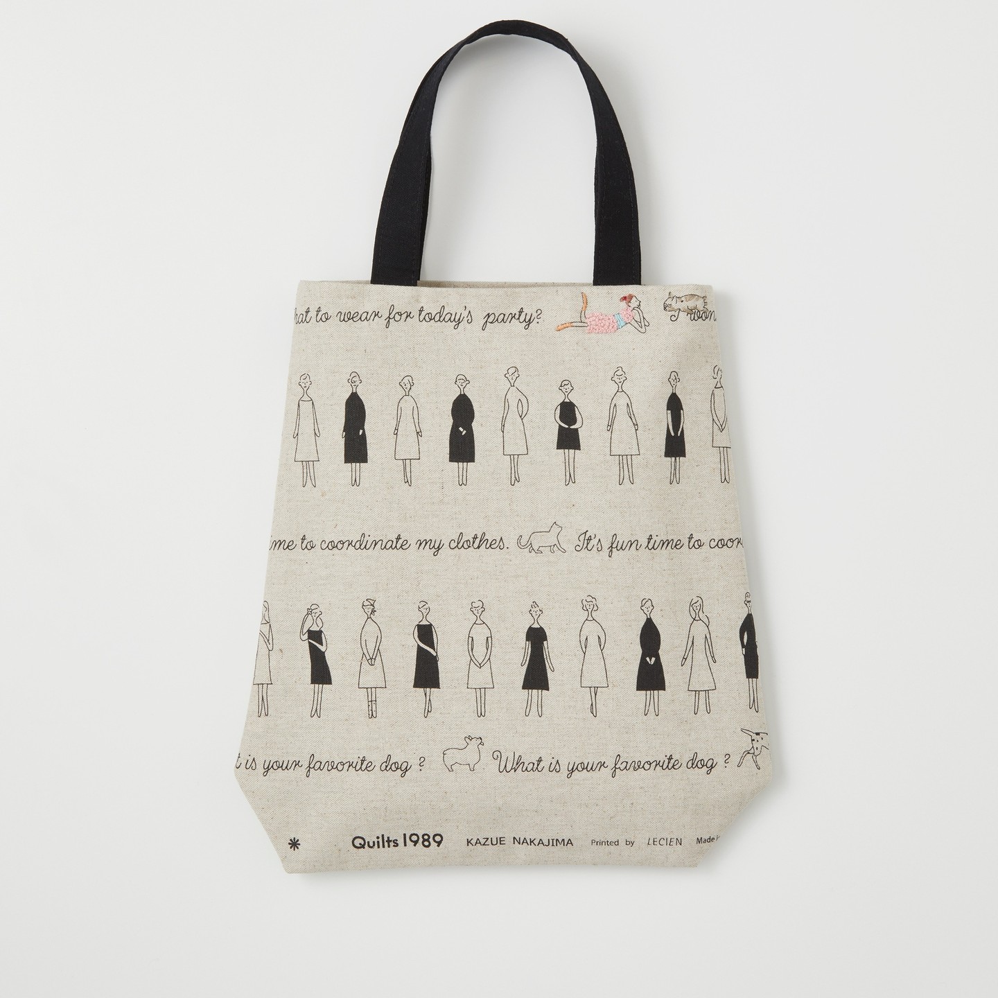 Embroidered linen tote with fashion-line motif and small floral accents